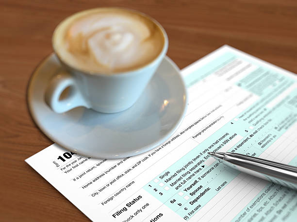 istock Tax form payment coffee cup 505626728