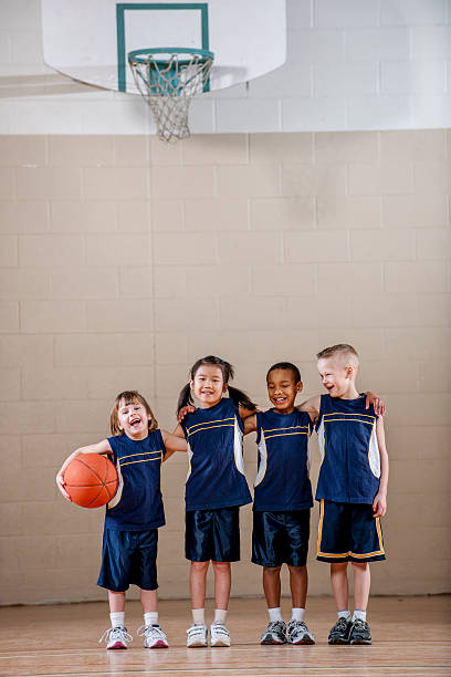 istock Kids Standing Together Before a Basketball Game 505627840