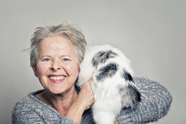 istock senior woman happy with her cat 505627892
