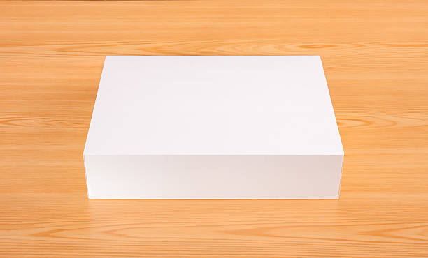 istock Blank white box mock up on wood background 505627998
