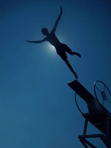 Photo of boy diving to sea