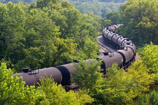 Tanker train going through the forest in Virginia, USA.