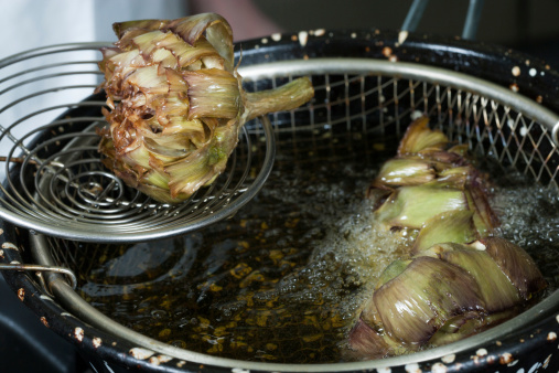 Artichokes drained after frying boiling oil