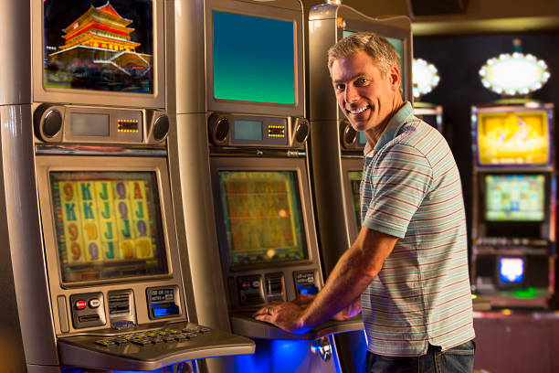 istock Man on Slot Machines 505635963
