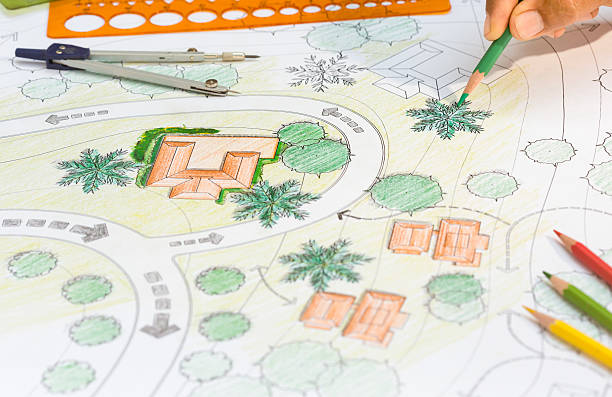 istock Landscape Architect Designs Blueprints For Resort. 505637832