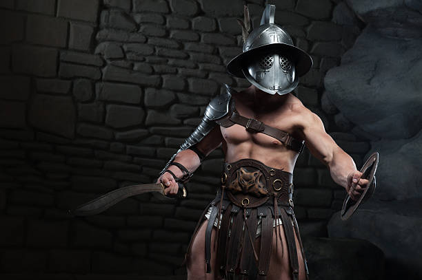 istock Gladiator in helmet and armour holding sword 505638077