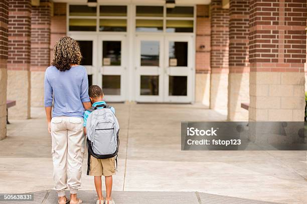 Nervous Boy First Day Of School Holds On To Mom Stock Photo - Download Image Now