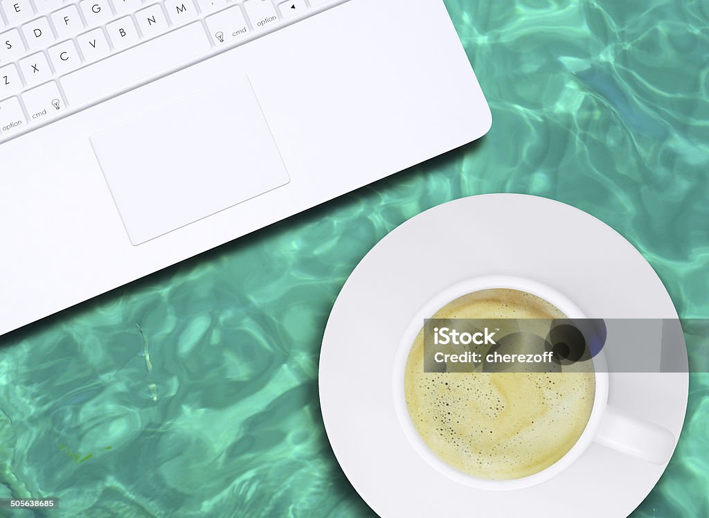 Laptop and coffee cup Laptop and coffee cup on water surface. Computer technology concept Backgrounds Stock Photo