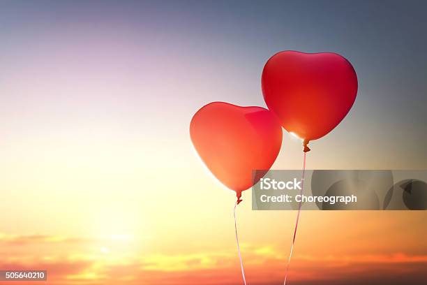 Two Red Balloons Stock Photo - Download Image Now - Romance, Love - Emotion, Balloon