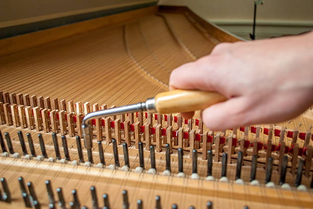 istock Harpsichord tuning the right tone ! 505640632