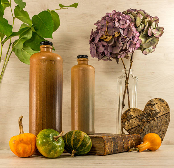 stil life  with stone bottles on wooden background