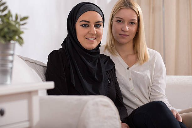istock Catholic girl and muslim 505640986