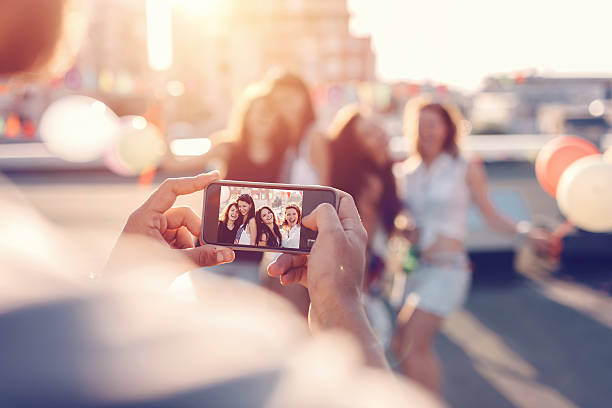 Friends photographing on the rooftop