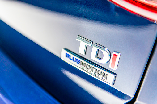 Brussels, Belgium - Januari 12, 2016: Close up of a Volkswagen TDi Bluemotion badge on the back of a Volkswagen Golf. in 2015 Volkswagen became the target of regulatory investigations in multiple countries because of irregularities in the NOx emissions on their diesel engines commonly referred to as 'Dieselgate'. The car is on display during the 2016 Brussels Motor Show. 