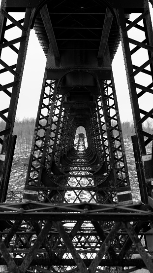 Old iron railroad trestle broken in half by a windshear