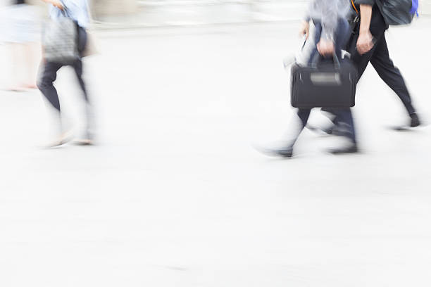 istock motion blur business people walking 505646086