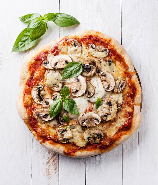 Pizza with mushrooms and basil