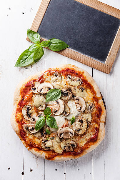 istock Pizza with mushrooms and chalk board 505646702