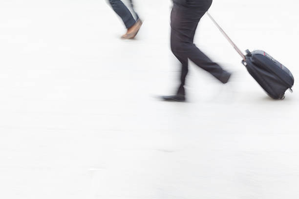 istock motion blur business people walking 505646740