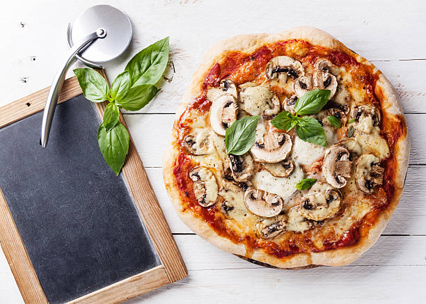 istock Pizza with mushrooms and basil 505646770