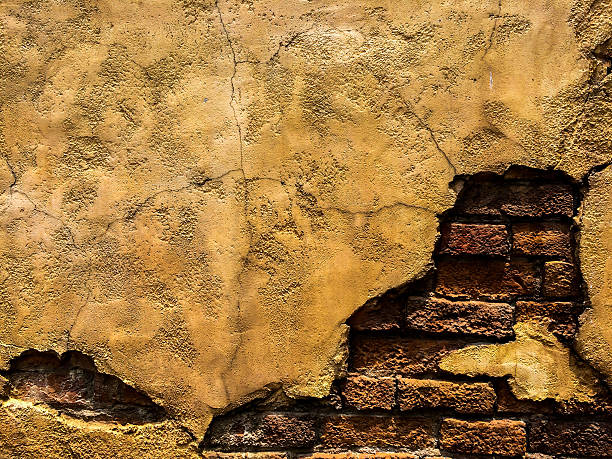 istock Cracked Old Vintage Brown Concrete Wall with Brick 505649250