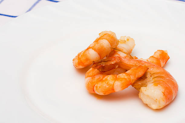 istock shrimp fried in oil laid out on a white plate 505650060