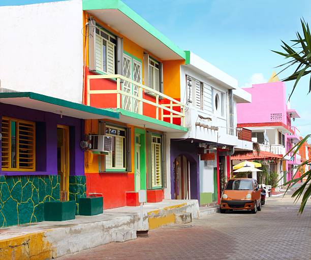 colorful Caribbean houses tropical Isla Mujeres colorful Caribbean houses tropical vivid colors Isla Mujeres Mexico isla mujeres stock pictures, royalty-free photos & images