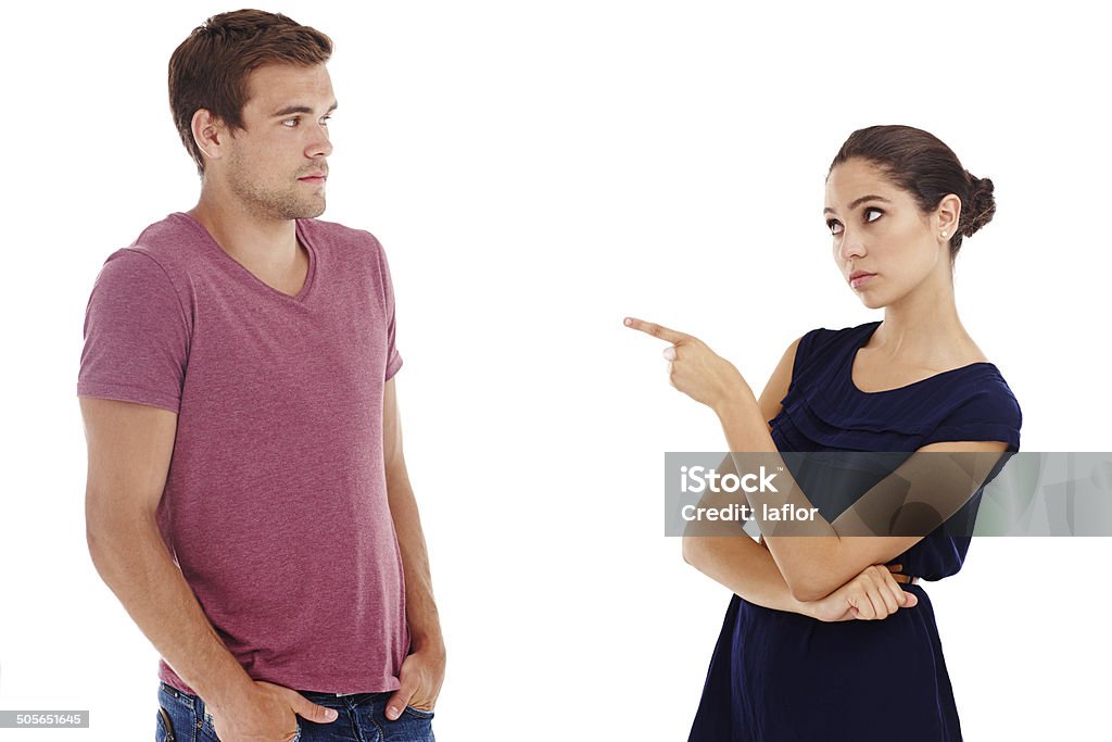 In the dog box!!! Cropped shot of a gorgeous young couple arguing while standing in a studio-isolated on white Cut Out Stock Photo