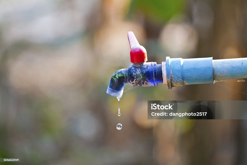hand hold outdoor water tap with tube Fire Hydrant Stock Photo