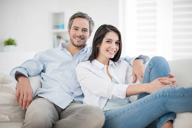 istock Couple at home relaxing in sofa 505653317