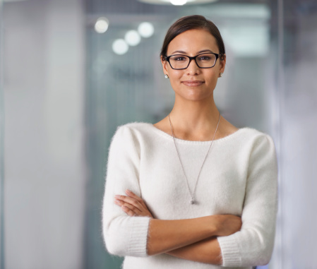 A cropped portrait of an attractive young businesswoman standing in an office