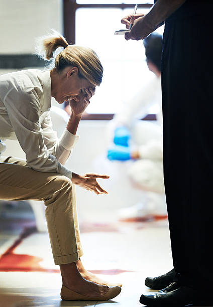 How could this have happened? Shot of a grief stricken woman giving her statement to a police officer at a crime scene victim advocacy stock pictures, royalty-free photos & images