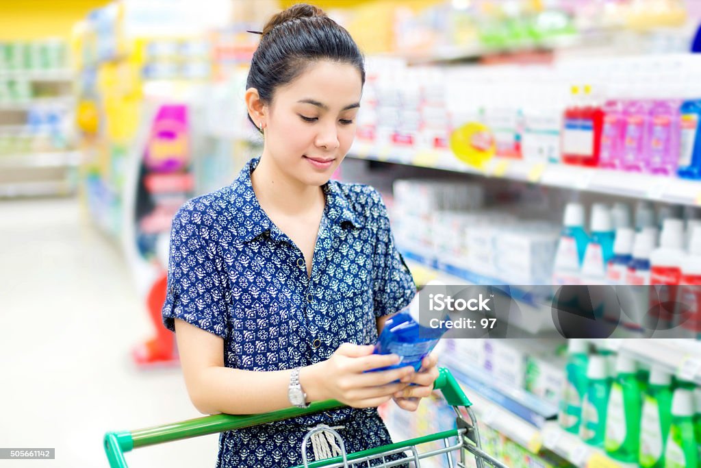 Asian woman buys mouthwash Mouthwash Stock Photo