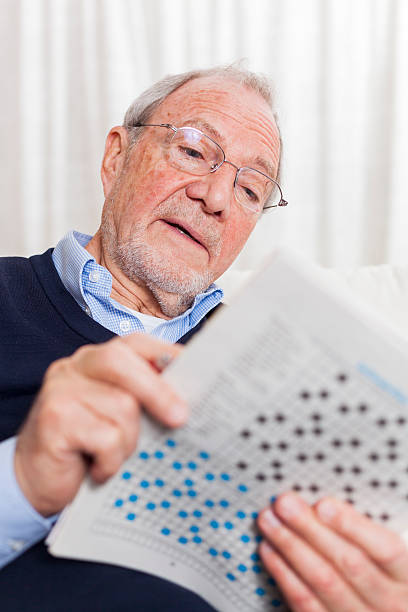 istock older senior man at home reading enjoying retirement 505663506