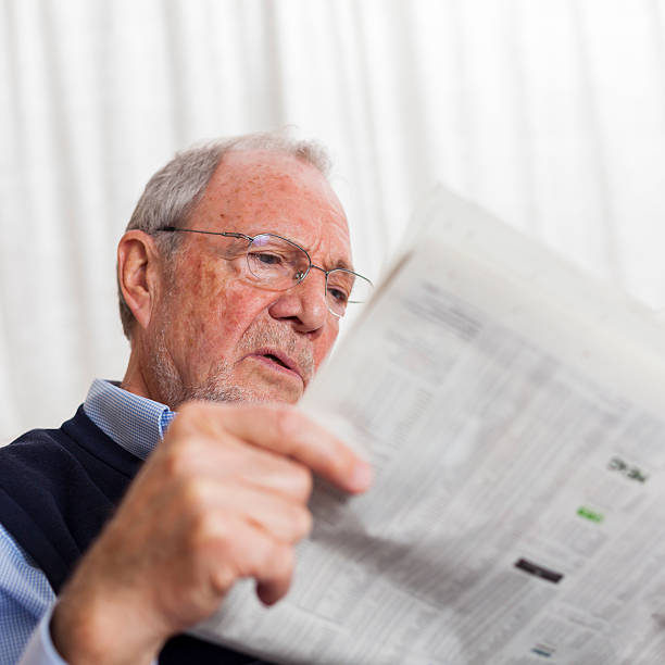 istock older senior man at home reading enjoying retirement 505663534