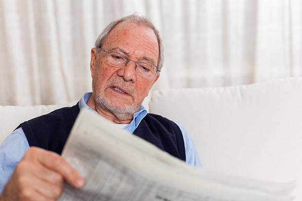 istock older senior man at home reading enjoying retirement 505663590