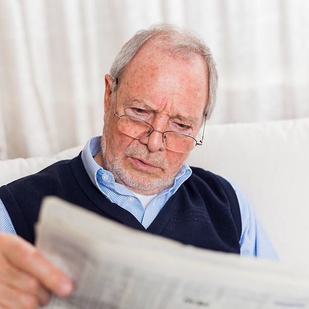 istock older senior man at home reading enjoying retirement 505663666