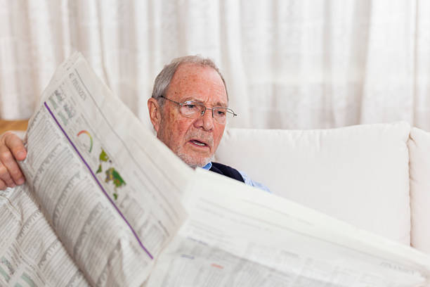istock older senior man at home reading enjoying retirement 505663706