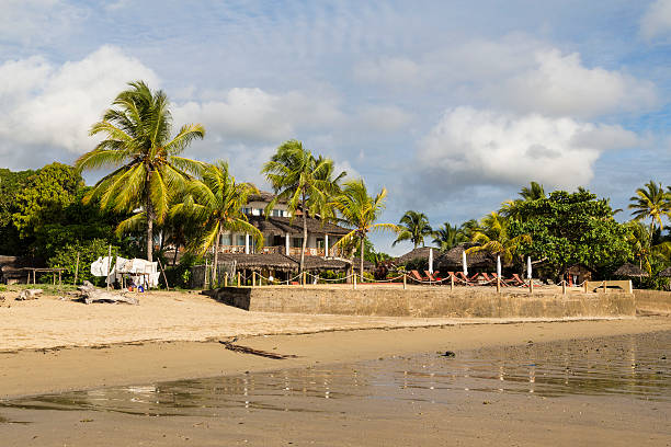 istock Tropical hotel resort on a sand beach shore 505663918