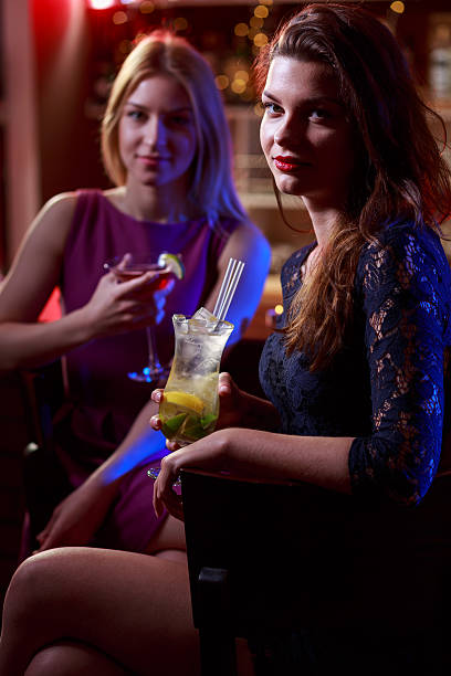 istock Young girls drinking in nightclub 505664110