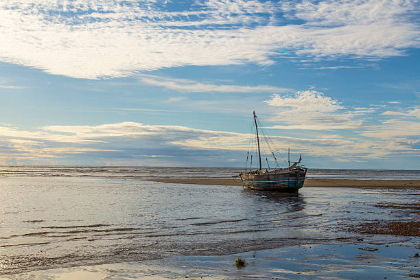 istock Stranded boat on a low tide beach in Madagascar 505664736
