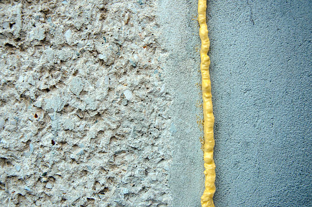 polyurethane foam filled crack in the wall stock photo
