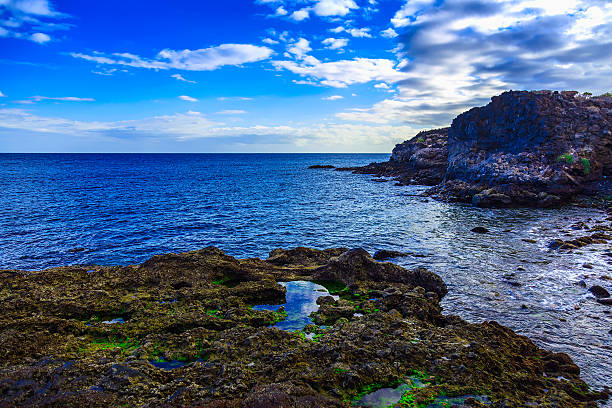Stone Beach of Atlantic Ocean with Waves on Canary Island in Spain at Day