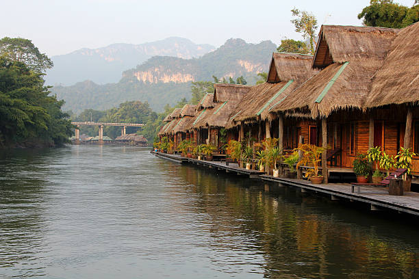 istock Nature background. Village on the river 505668570