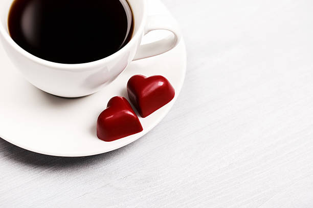 istock Cups of coffee and heart shaped sweets 505669154