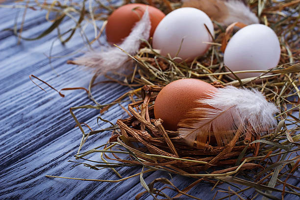 istock Brown and white eggs on  wooden background 505669766