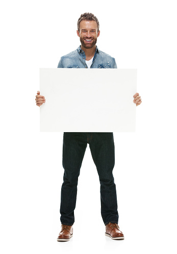 Smiling casual man holding placardhttp://www.twodozendesign.info/i/1.png