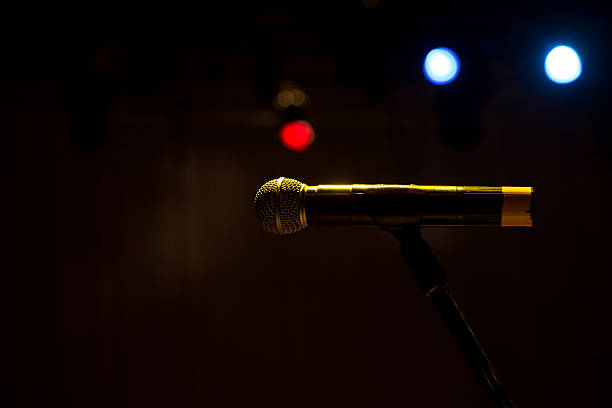 istock Close up of microphone in concert hall 505670346