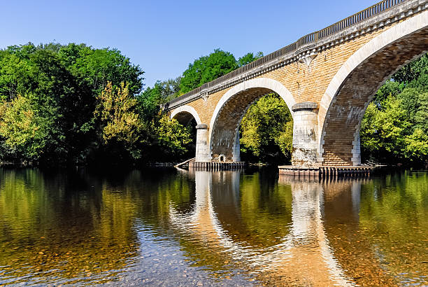 istock Old Stone Arched Bridge in France 505672080