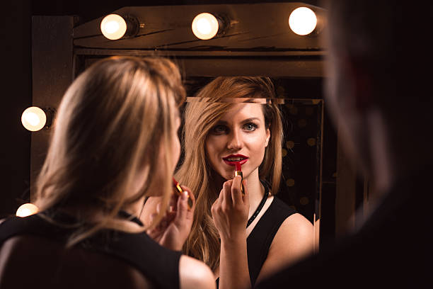 istock Alluring woman applying red lipstick 505673906
